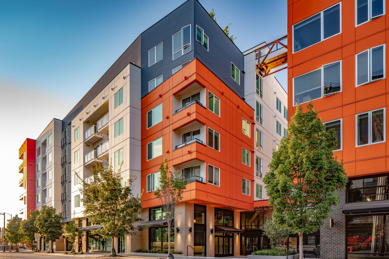 Crew installing exterior trim on multifamily building